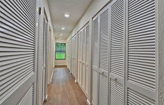 corridor featuring light hardwood / wood-style flooring