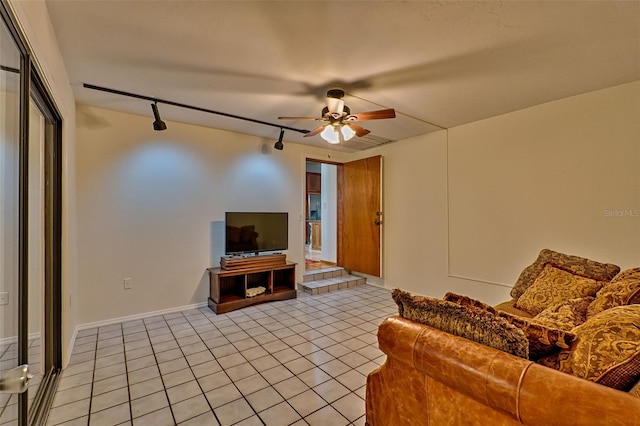 living room with rail lighting, light tile patterned flooring, and ceiling fan