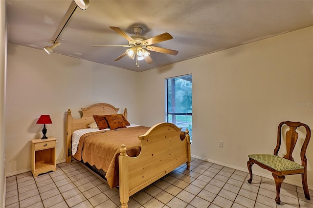 tiled bedroom featuring ceiling fan and rail lighting