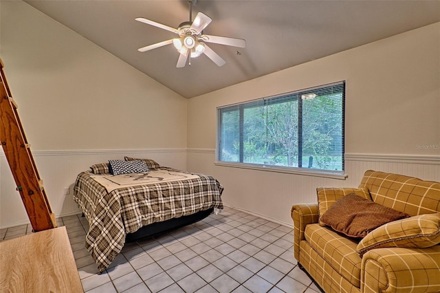 bedroom featuring light tile patterned floors, vaulted ceiling, and ceiling fan