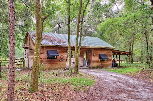 log cabin with a carport