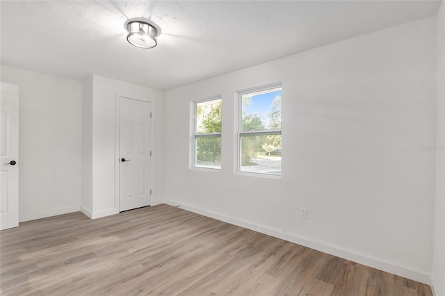 unfurnished room featuring light wood-type flooring