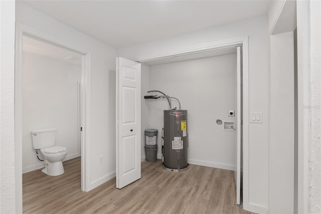 utility room featuring water heater