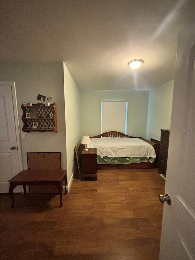 bedroom with hardwood / wood-style flooring