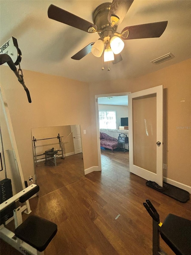 interior space featuring ceiling fan and dark hardwood / wood-style floors