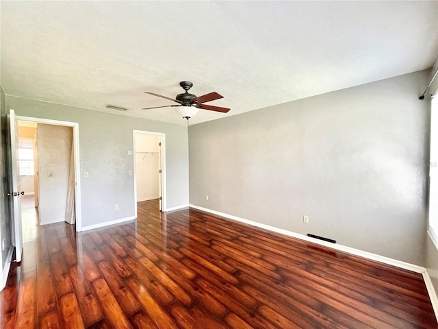 unfurnished bedroom featuring dark hardwood / wood-style flooring and ceiling fan