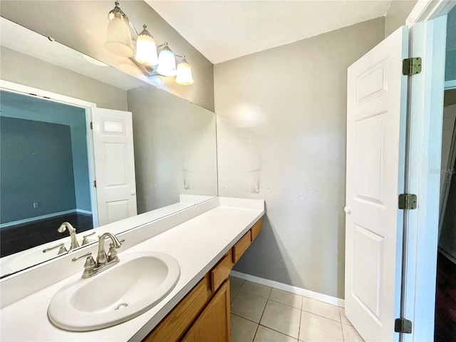 bathroom with tile patterned floors and vanity