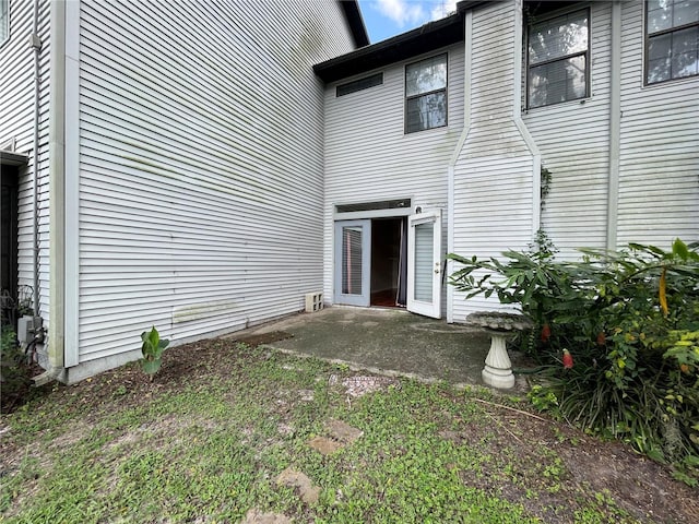 doorway to property with a patio