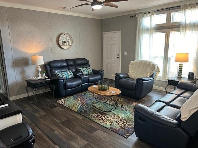 living room with ceiling fan, ornamental molding, dark hardwood / wood-style flooring, and a wealth of natural light