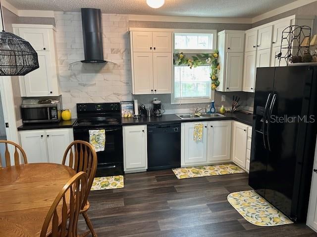 kitchen featuring black appliances, dark hardwood / wood-style floors, wall chimney exhaust hood, white cabinetry, and a textured ceiling