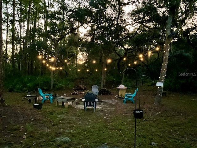 view of yard featuring a fire pit