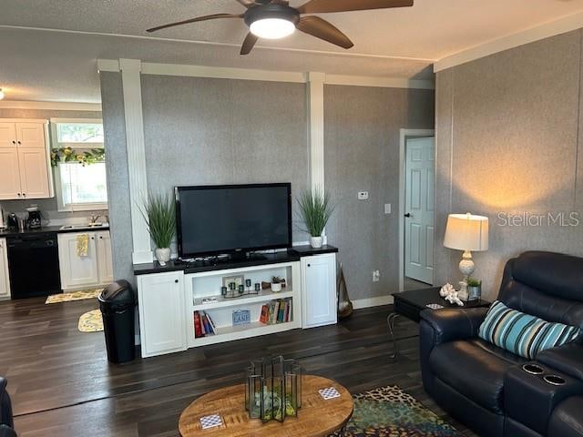 living room featuring dark hardwood / wood-style flooring and ceiling fan