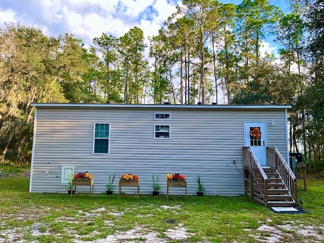 back of house with a yard