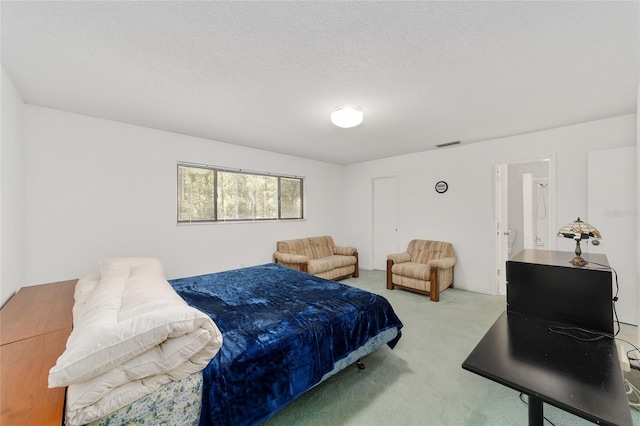 carpeted bedroom with a textured ceiling