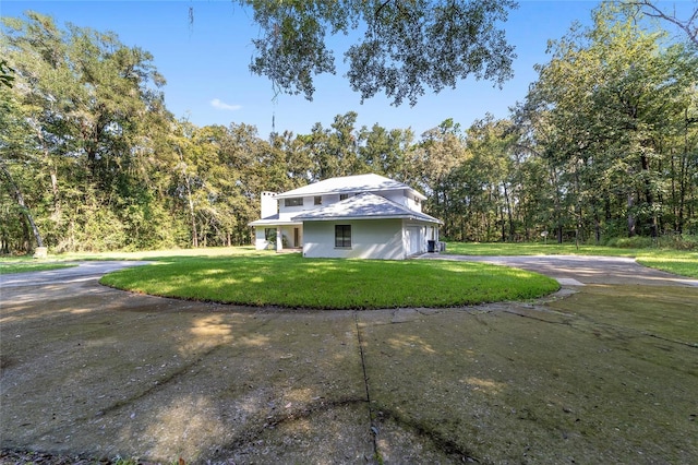 back of house with a yard