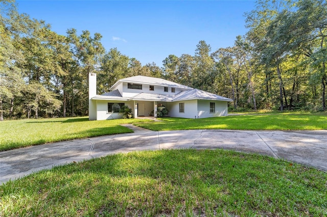 view of front of property with a front lawn