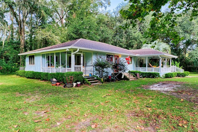 single story home featuring a front lawn and covered porch