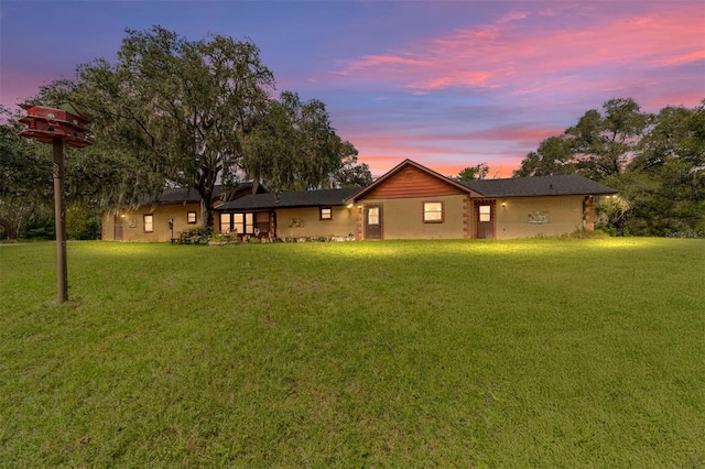 view of yard at dusk