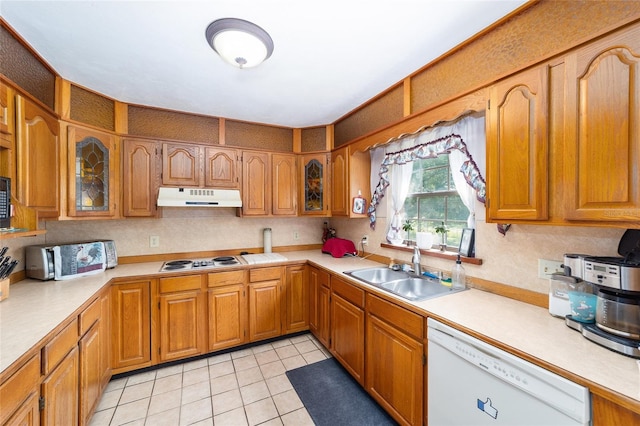 kitchen with white appliances, sink, and light tile patterned floors