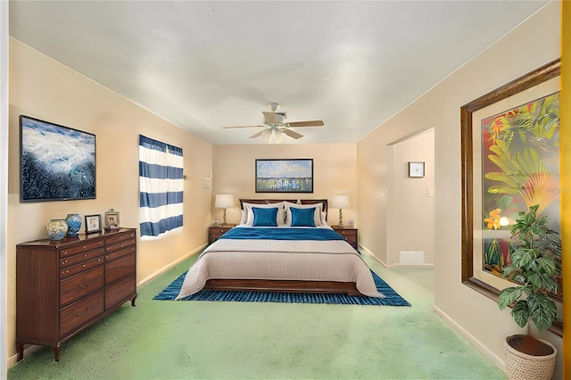 carpeted bedroom featuring ceiling fan