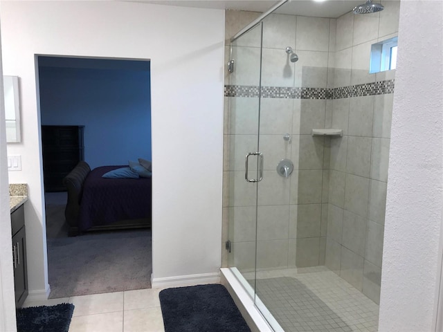 bathroom featuring vanity, tile patterned floors, and a shower with door