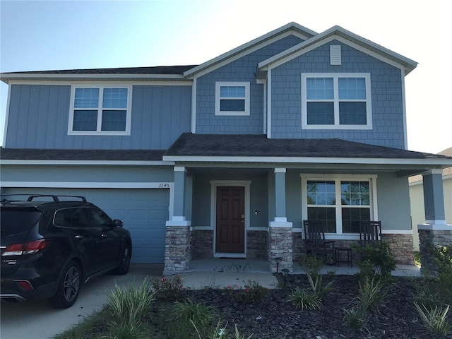 craftsman-style house with a garage and covered porch