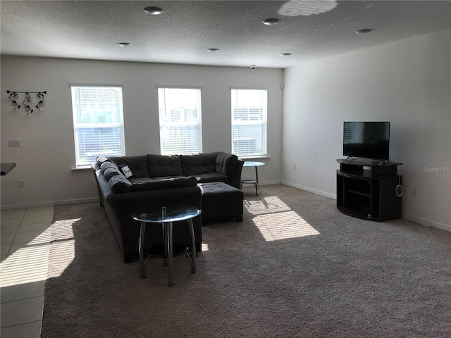 living room with dark colored carpet and a textured ceiling