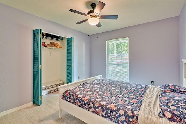 bedroom featuring a closet, ceiling fan, and hardwood / wood-style flooring