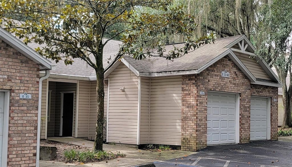 view of side of property featuring a garage