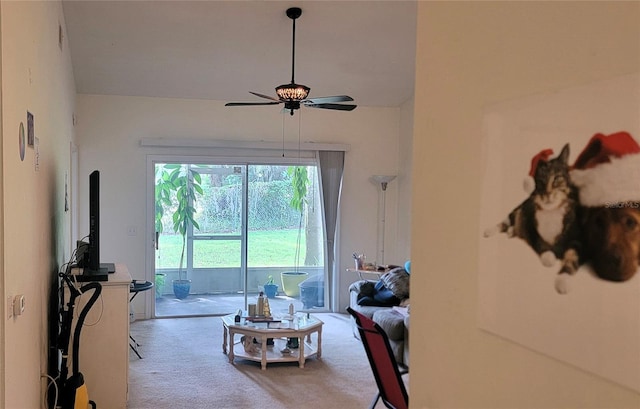 living room with ceiling fan and carpet floors