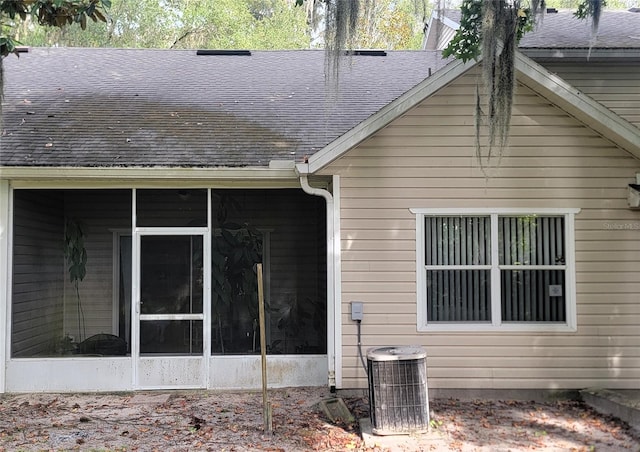 back of house with a sunroom and central air condition unit