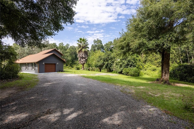 view of front of house featuring a front yard and a garage