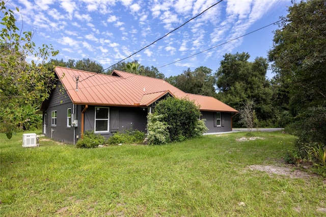 view of side of home featuring a yard