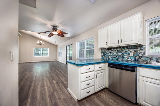 kitchen featuring white cabinets, lofted ceiling, dark wood-type flooring, dishwasher, and ceiling fan with notable chandelier