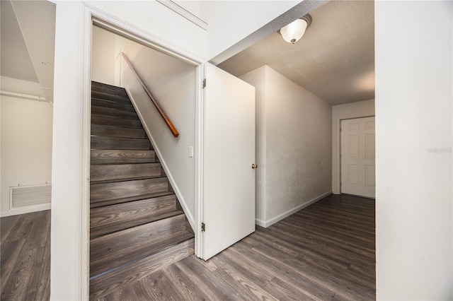 staircase featuring hardwood / wood-style flooring