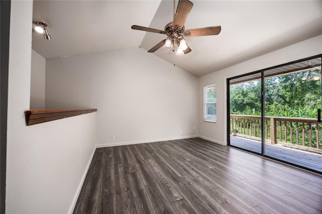 spare room featuring lofted ceiling, ceiling fan, and dark wood-type flooring