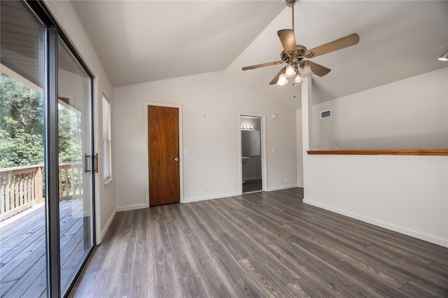 interior space featuring vaulted ceiling, ceiling fan, and dark wood-type flooring