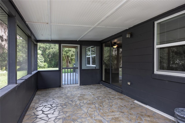 unfurnished sunroom with plenty of natural light