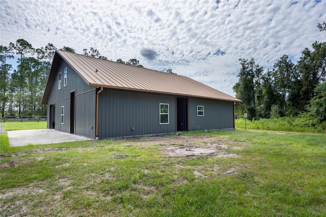 view of property exterior with a lawn