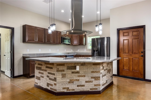 kitchen with appliances with stainless steel finishes, hanging light fixtures, island exhaust hood, dark brown cabinetry, and a kitchen island with sink