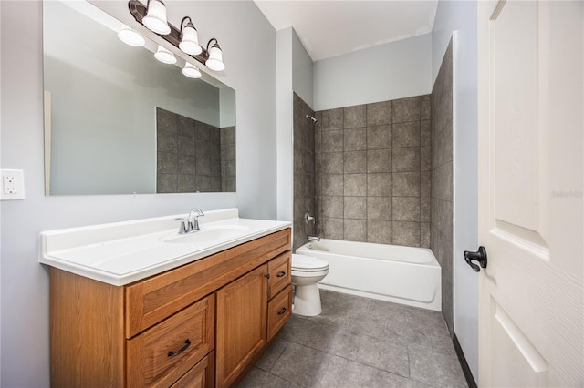 full bathroom with tiled shower / bath, vanity, toilet, and tile patterned floors