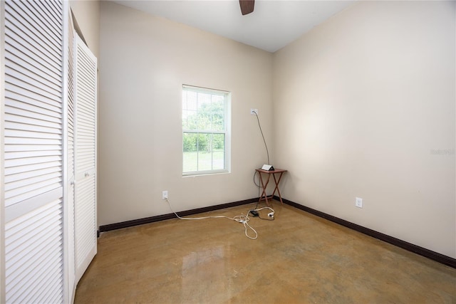 unfurnished bedroom featuring ceiling fan and concrete flooring