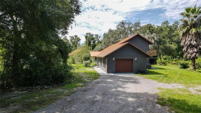 131 Riley Lake Dr, Hawthorne, FL 32640 - view of home's exterior with a lawn and driveway