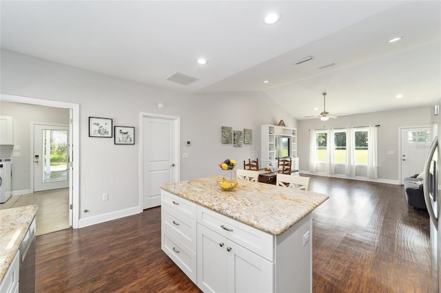 kitchen featuring lofted ceiling, dark hardwood / wood-style floors, white cabinetry, and ceiling fan