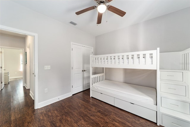 unfurnished bedroom featuring dark hardwood / wood-style floors and ceiling fan