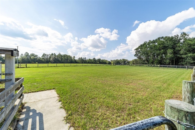 view of yard with a rural view