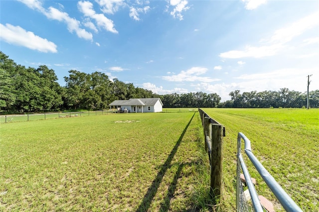 view of yard with a rural view