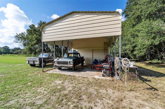 view of outdoor structure with a carport and a yard