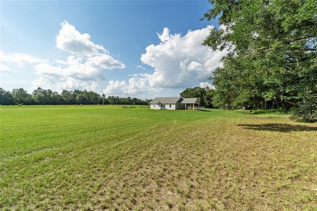 view of yard with a rural view