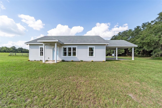 back of property with a lawn and a patio area